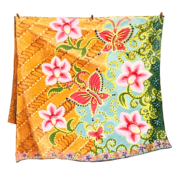 A vibrant, hanging cloth showcases a pattern of pink flowers and red butterflies on a multicolored, paisley background.